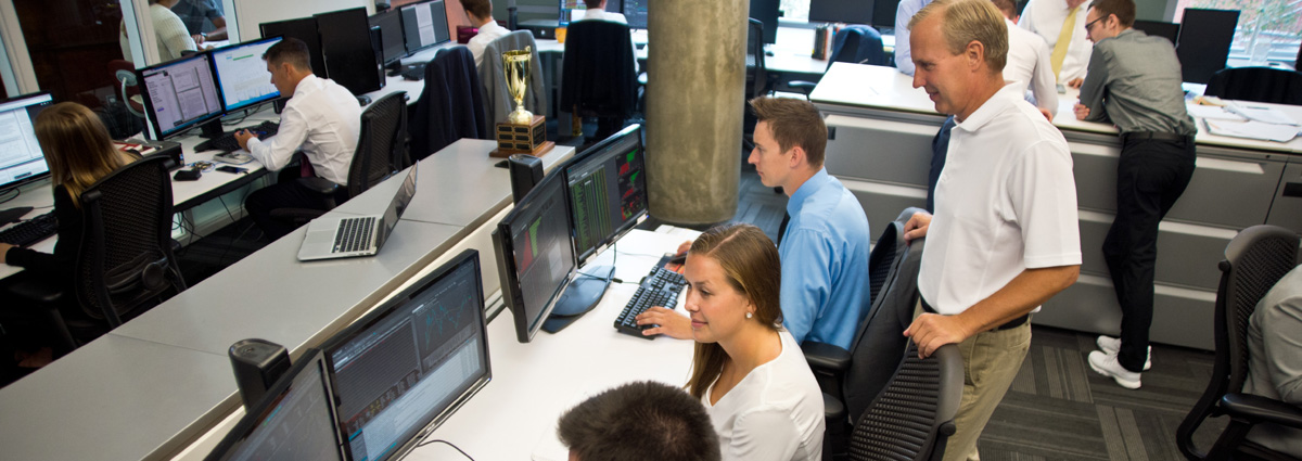 group of students working in the financial markets computer lab
