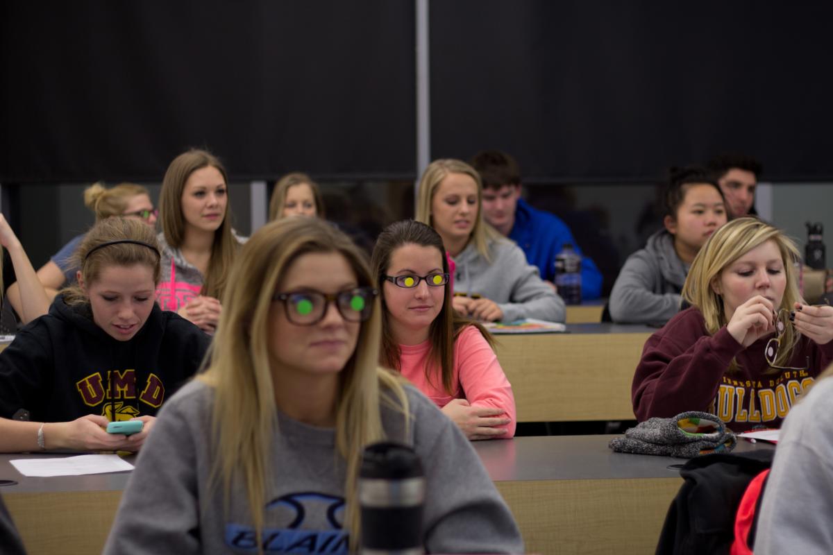 Students in the Long-term Care Course add stickers to their glasses. 